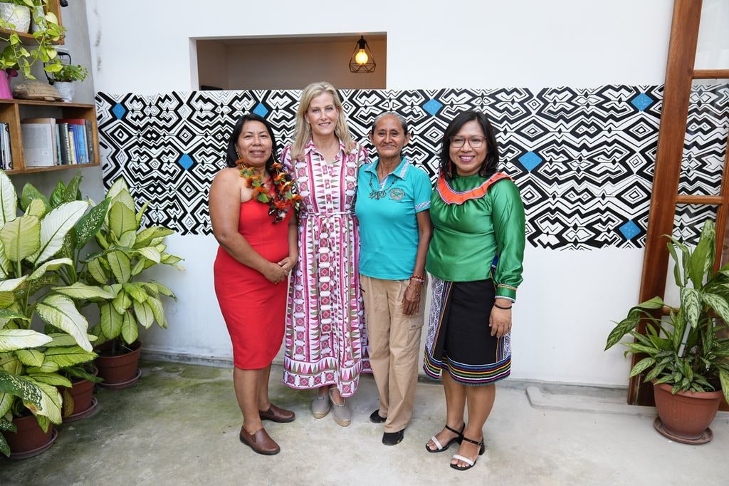 The Duchess of Edinburgh stands with three women in geometric dress