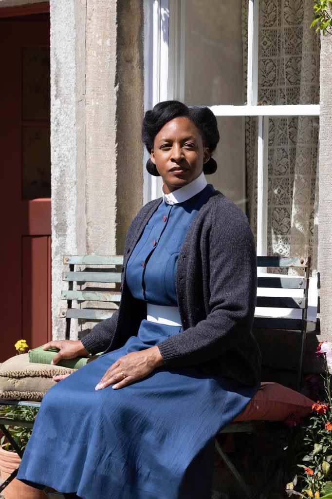 nurse sitting on bench outside house