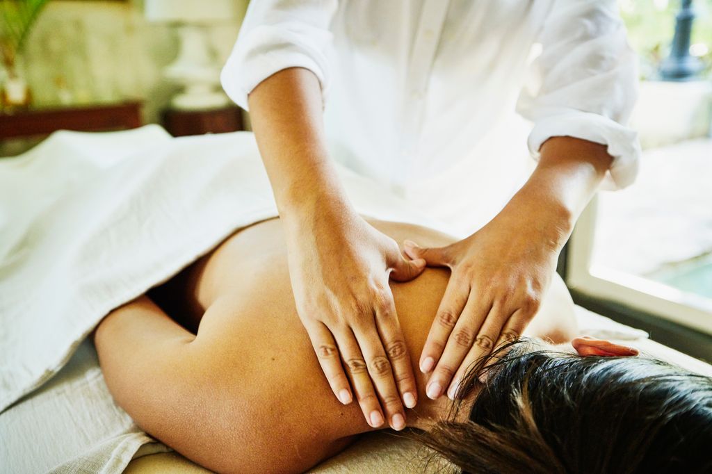 Close up shot of woman receiving massage at luxury spa