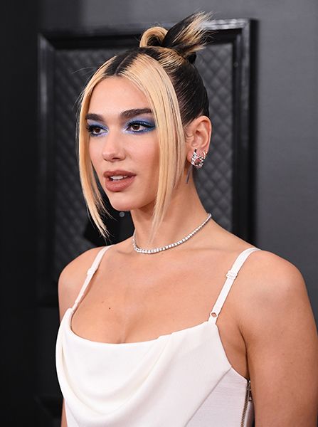 Dua Lipa Wearing A Loose Middle Parting Hair Look