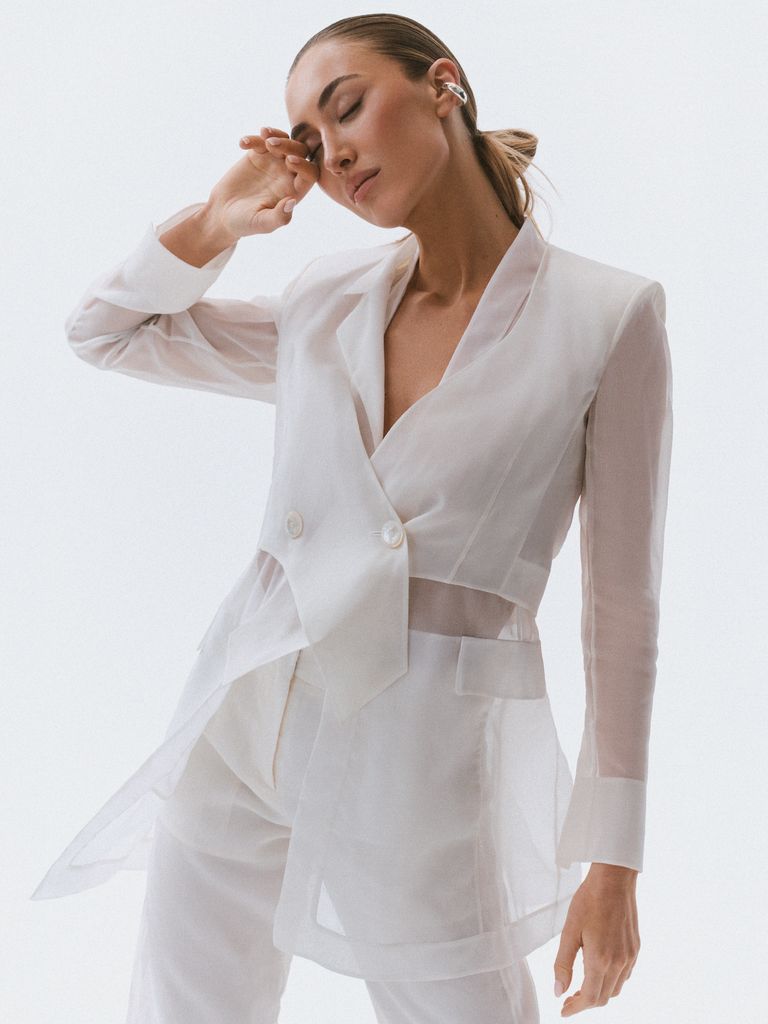 Top: Akris, £2150, Akris.
Blazer: Akris, £3420.
Trouser: Akris, £1510.
Earcuff: Paula Mendoza, £82.
