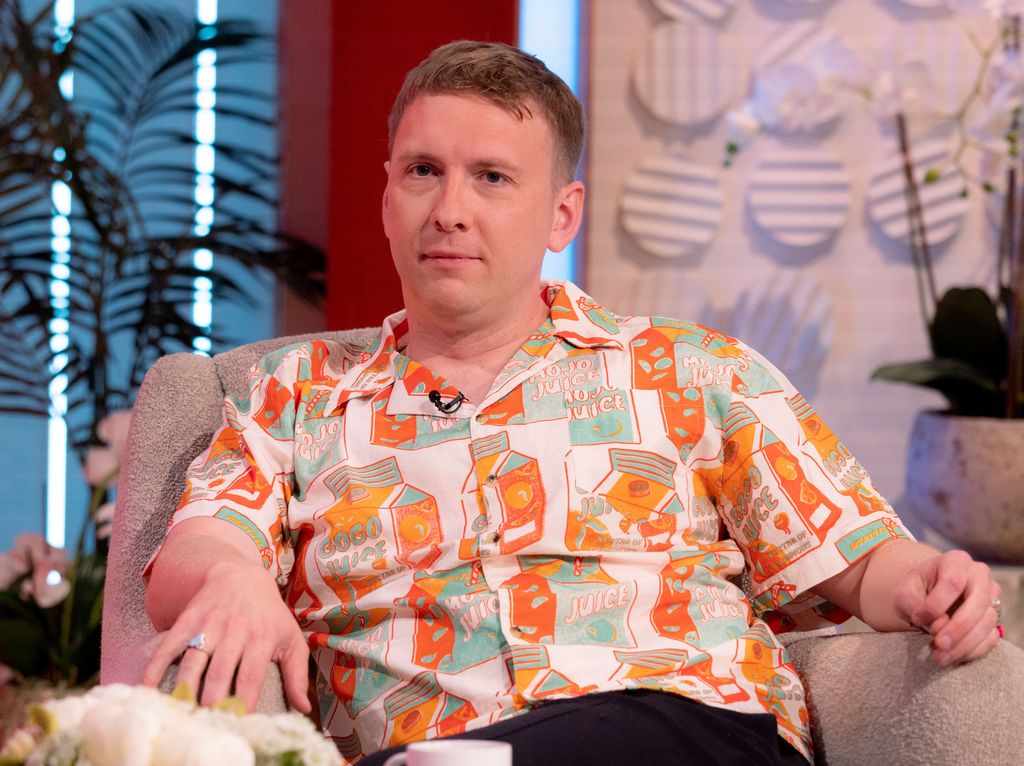 Joe Lycett looking sad in an armchair