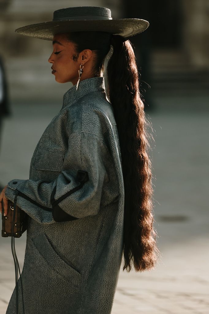 woman in hat with long ponytail