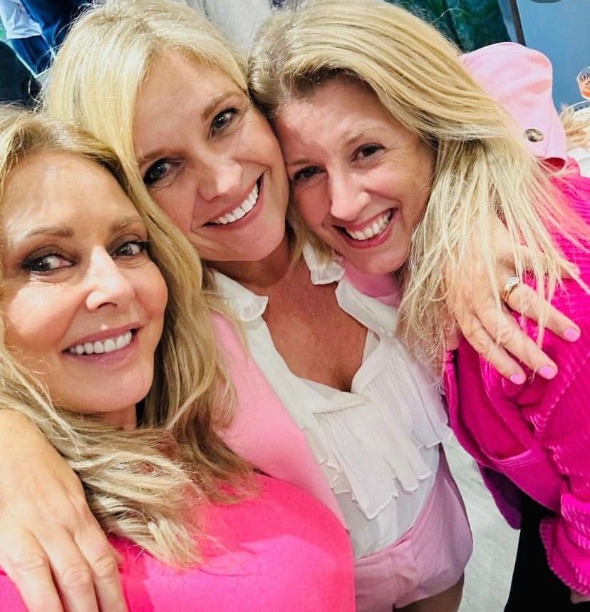 Carol Vorderman smiling with two female friends