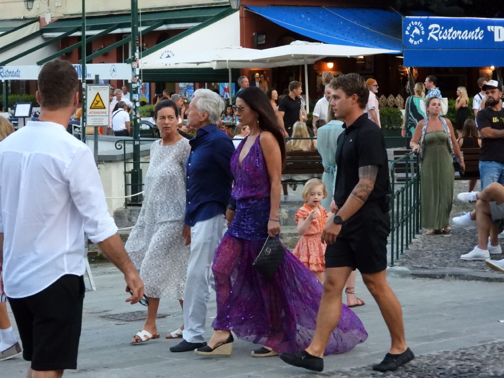 Michael Douglas and Catherine Zeta-Jones hold hands as they walk round Portafino