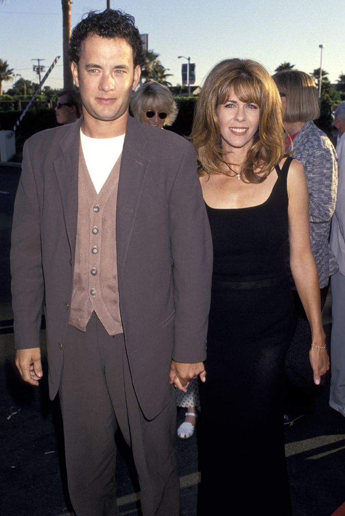 Tom Hanks and Rita Wilson holding hands 