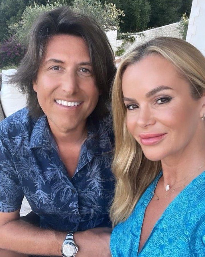 Amanda Holden and Chris Hughes smiling on holiday