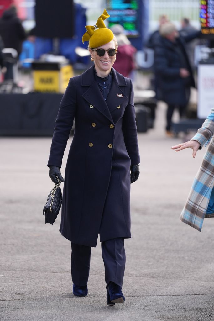 Zara Tindall wears a navy outfit at the Cheltenham Festival at Cheltenham Racecourse, Cheltenham, Gloucestershire, UK, on the 11th March 2025.