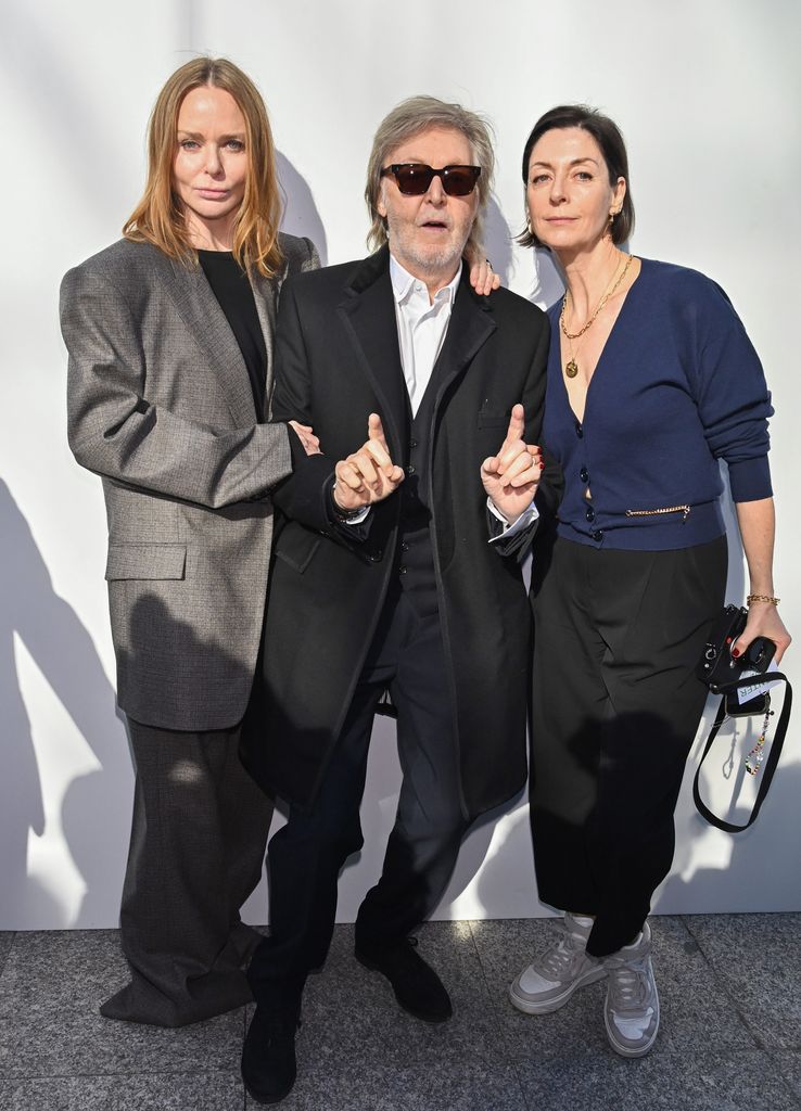 paul poses with his daughters Mary and Stella 