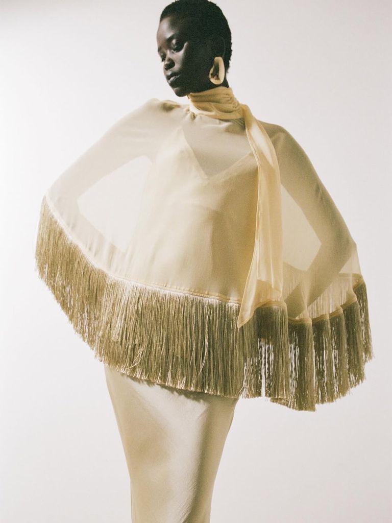 model in yellow fringed dress