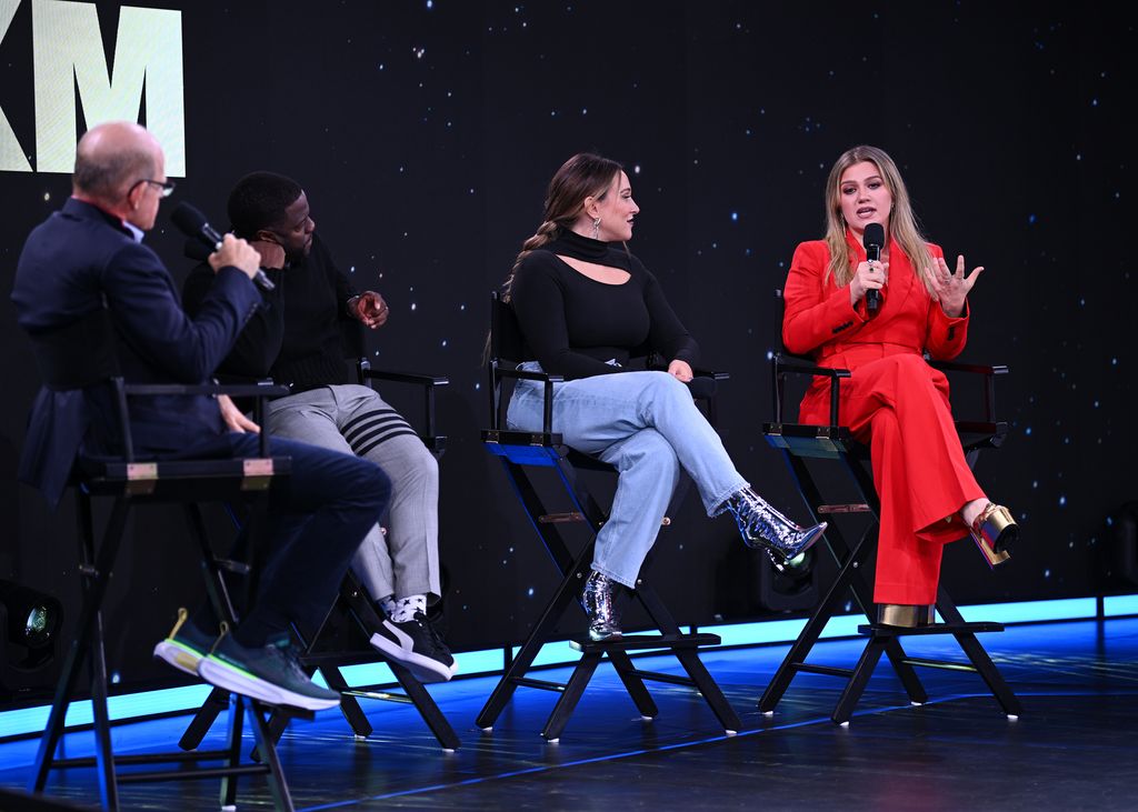 Scott Greenstein, Kevin Hart, Ashley Flowers, and Kelly Clarkson speak onstage during the SiriusXM event