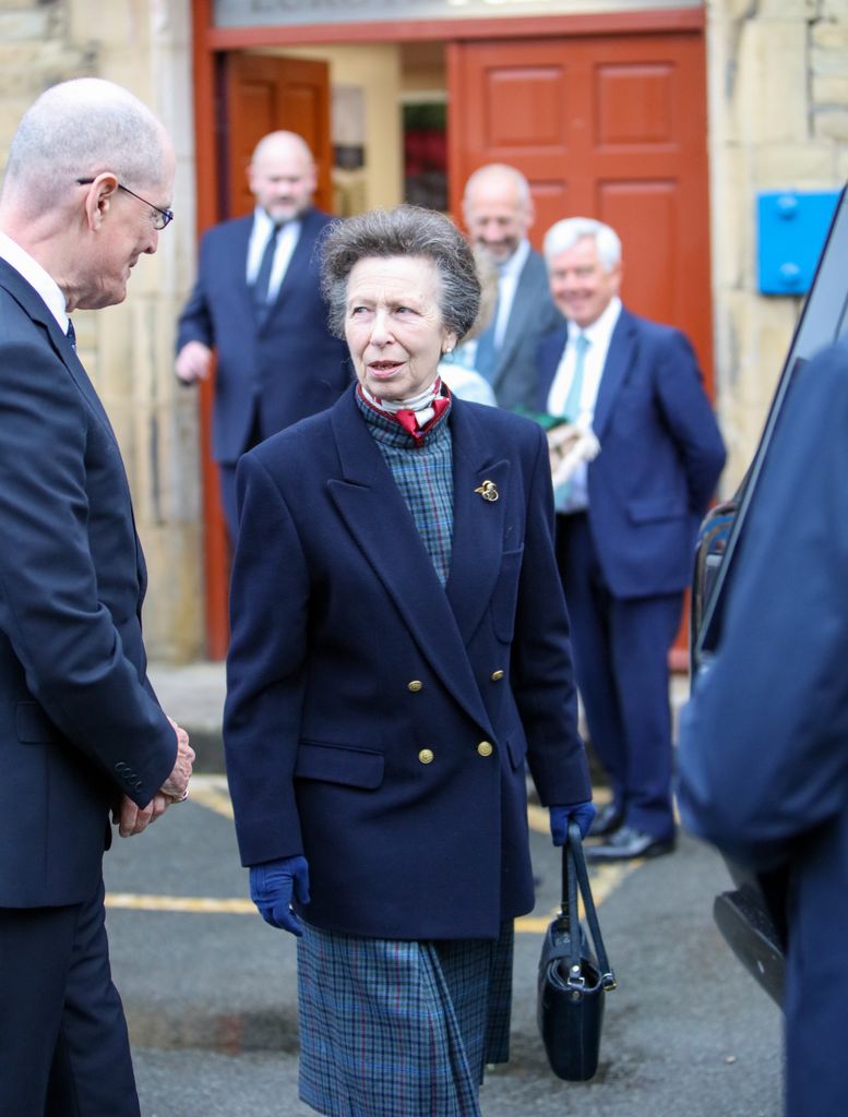 Anne looked chic in tartan and navy