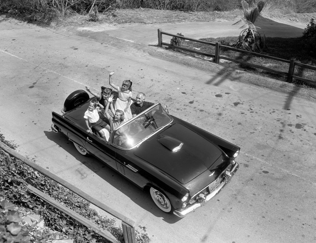 Tom Harmon, retired professional football player, a KNX / CBS sportscaster. Relaxes at home and with his family. back seat from left is Mark Harmon (who later becomes a notable actor); daughter, Kelly Harmon and daughter, Kristin Harmon. Front seat from left is wife, Elyse Knox and Tom Harmon. September 4, 1956. Los Angeles, CA