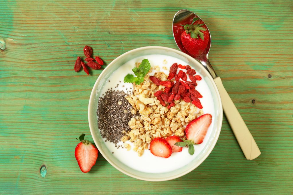healthy breakfast of muesli, yoghurt, chia seeds, fruit and goji