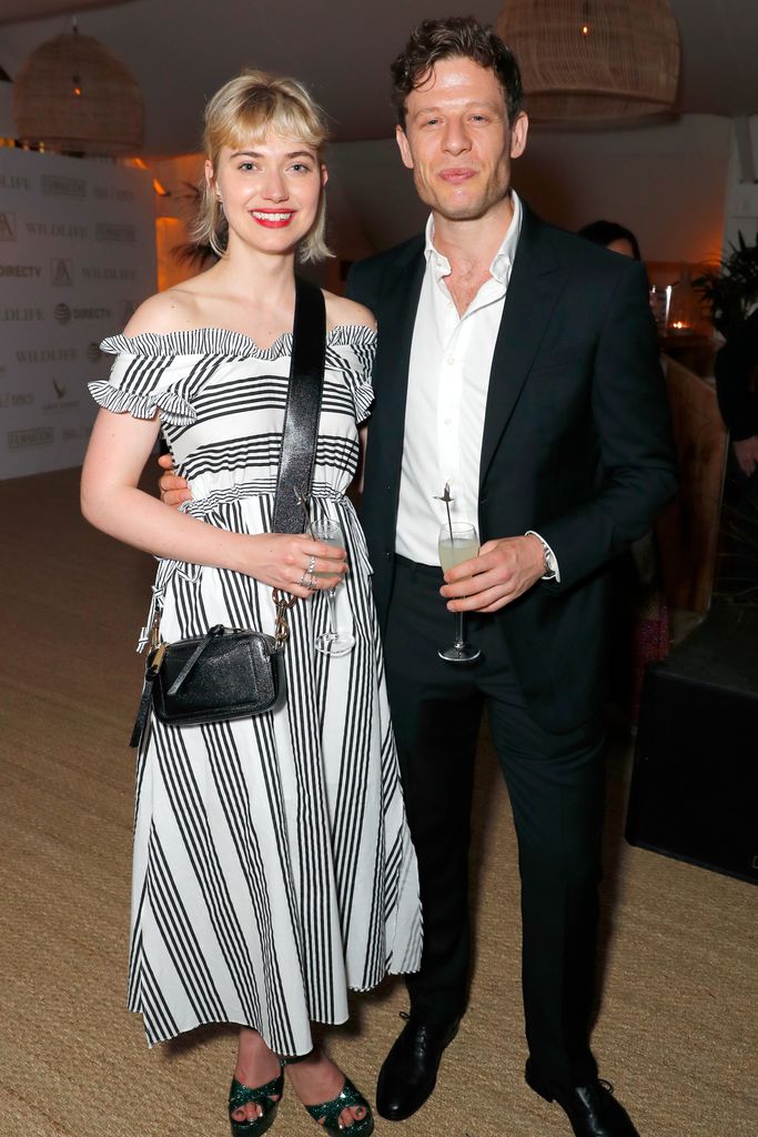 Imogen Poots in a striped dress with James Norton in a black suit