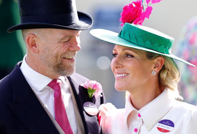 Zara and Mike Tindall smiling at each other at the races