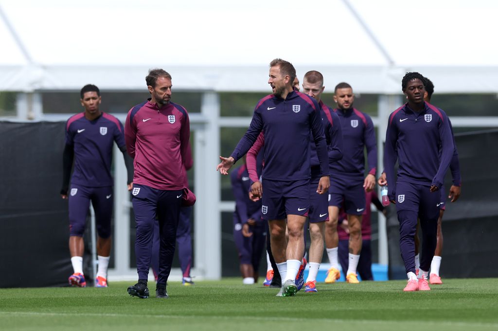 Gareth Southgate, Manager of England men's senior team, talks to Harry Kane of England during a training session at Spa & Golf Resort Weimarer Land on June 15, 2024 in Blankenhain, Germany