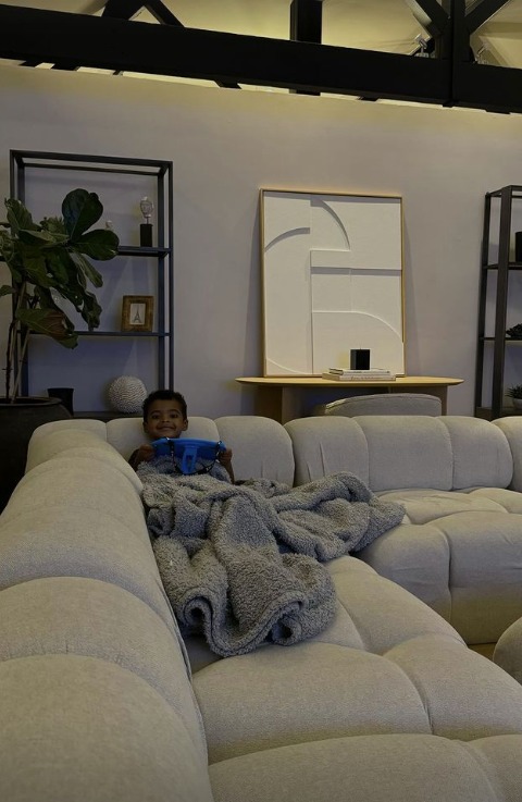 Rochelle and Marvin's son Blake in the lounge of their new home