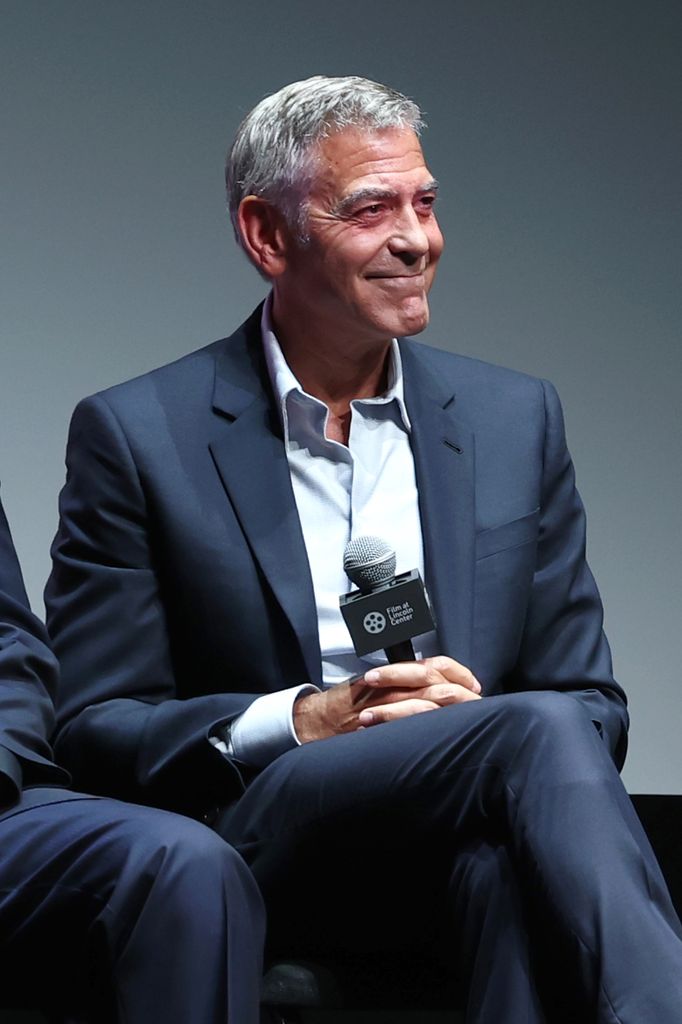 george clooney smiling on stage