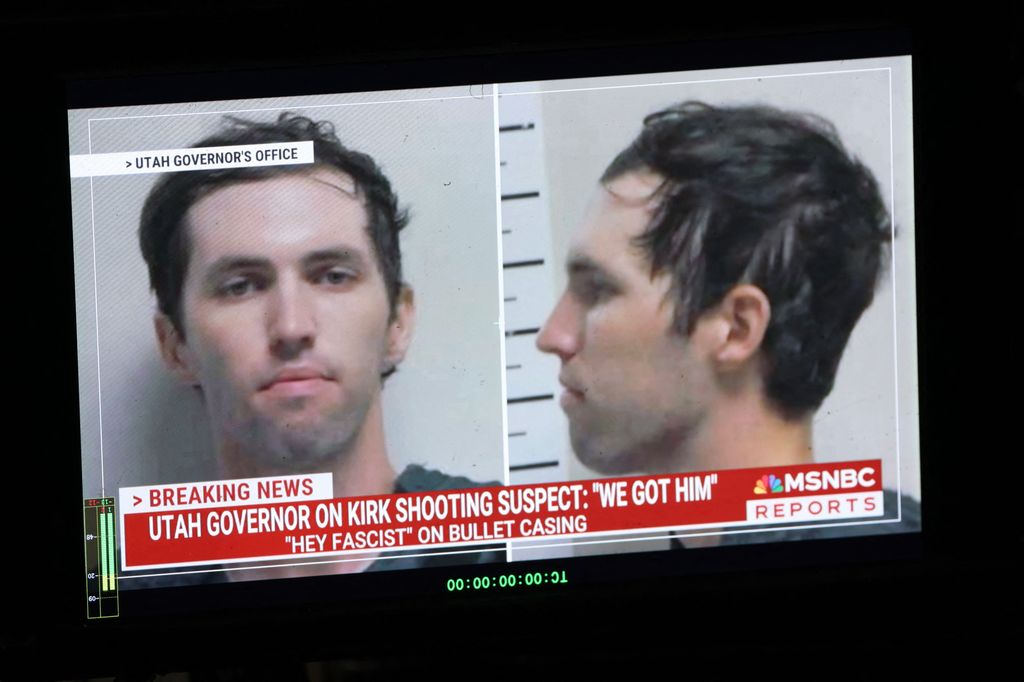 Tyler Robinson's mugshot on TV with breaking news