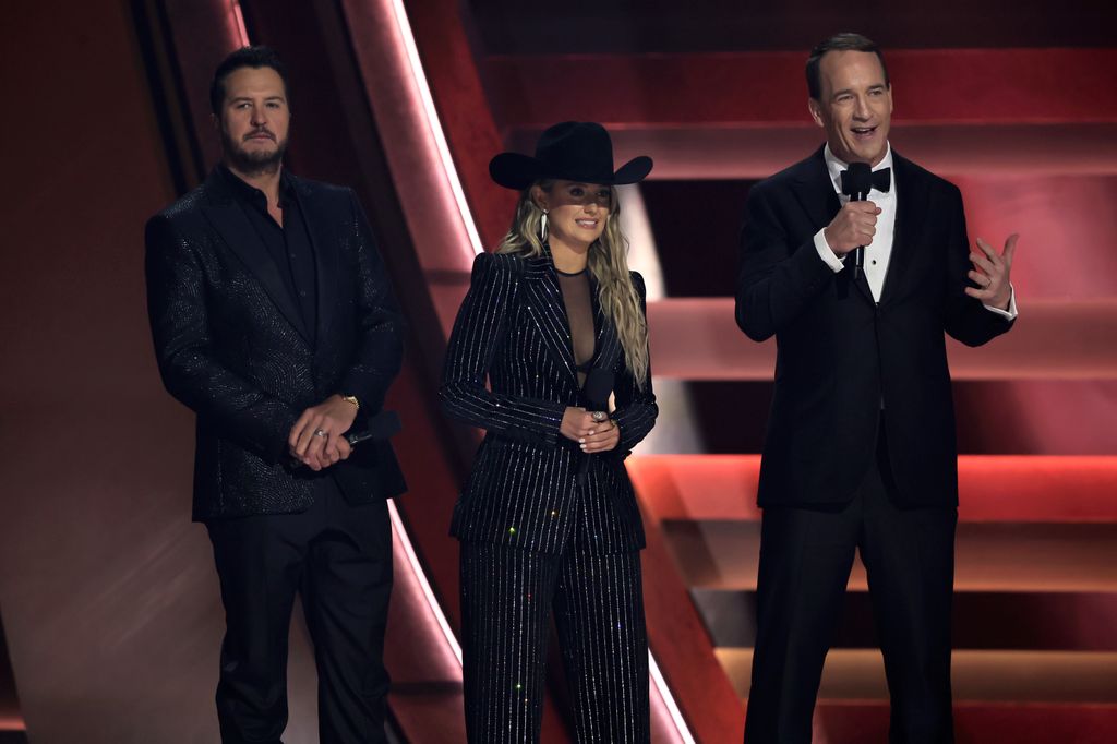 Luke Bryan, Lainey Wilson and Peyton Manning speak onstage during The 58th Annual CMA Awards at Bridgestone Arena on November 20, 2024 in Nashville, Tennessee. (Photo by Theo Wargo/Getty Images)