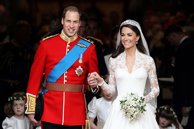 Prince William in red military uniform and Kate Middleton in bridal gown