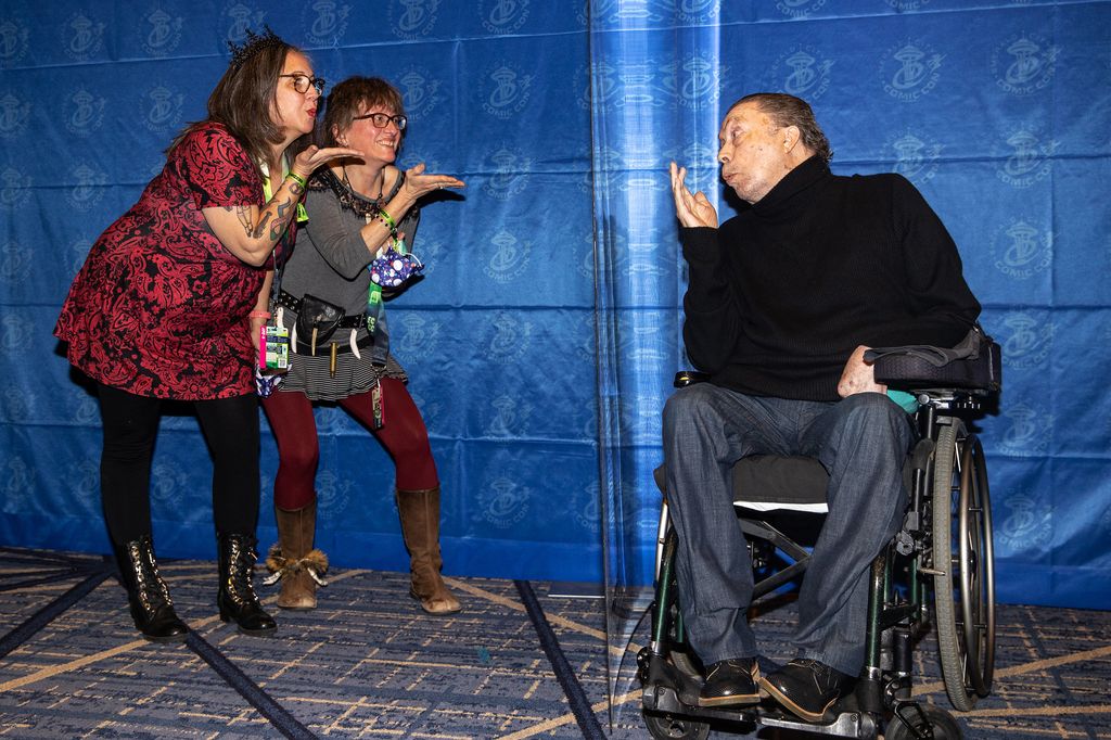 Actor Tim Curry blows a kiss to fans during Emerald City Comic Con at the Sheraton Grand Hotel on December 04, 2021 in Seattle, Washington