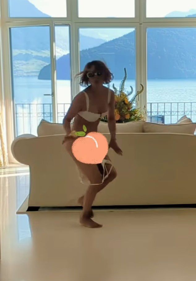 photo of halle berry with a peach emoji covering her lower half