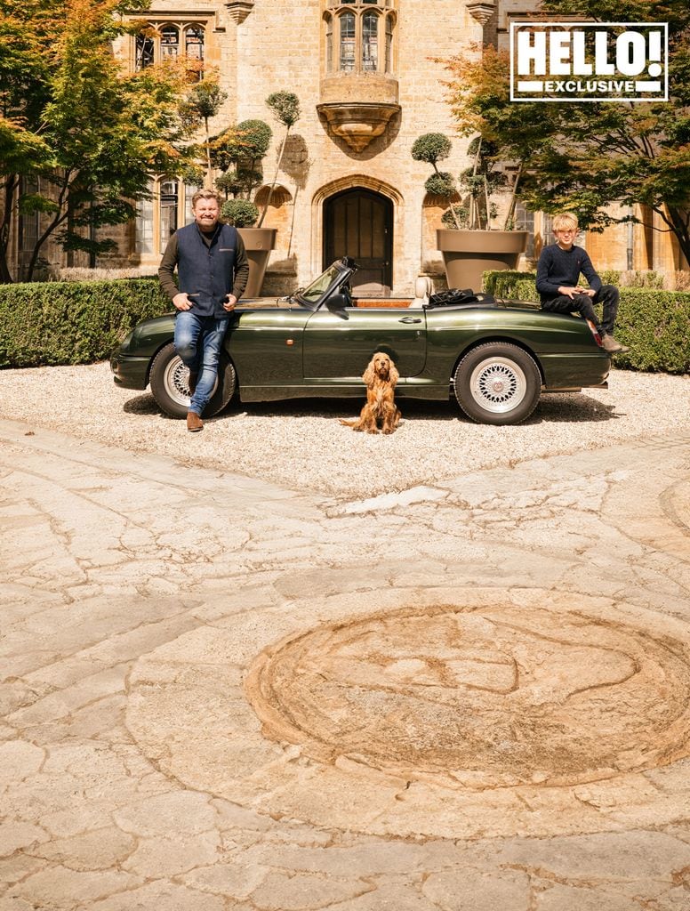 Parnham Park exterior shot of James Perkins and son with dog and car