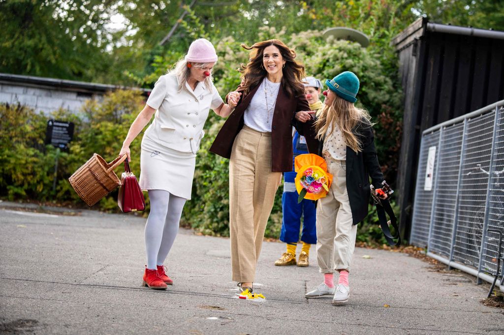 Mary laughing with clowns