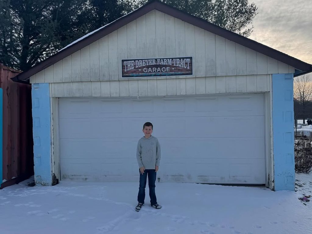 Dylan Dreyer son standing outside dad's former farm, snowy