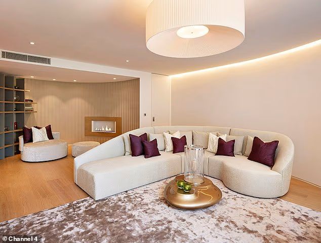  living room with white sofas and plum cushions