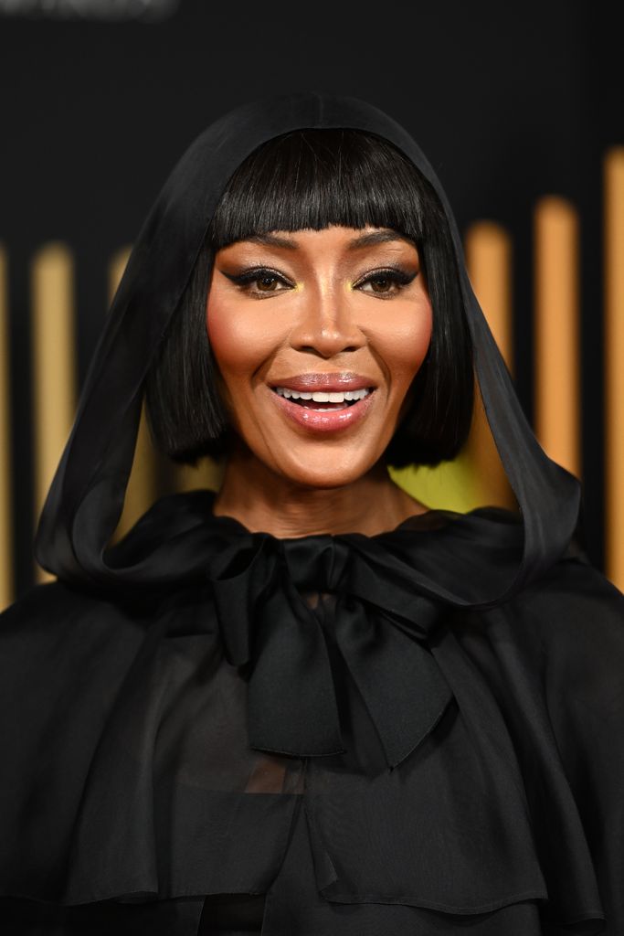 Naomi Campbell wearing a black veil and high-necked dress at the BAFTAs 