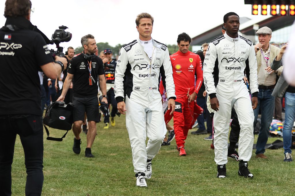  Brad Pitt,and Damson Idris, co-star of the upcoming Formula One based movie, Apex, walk on the grid 
