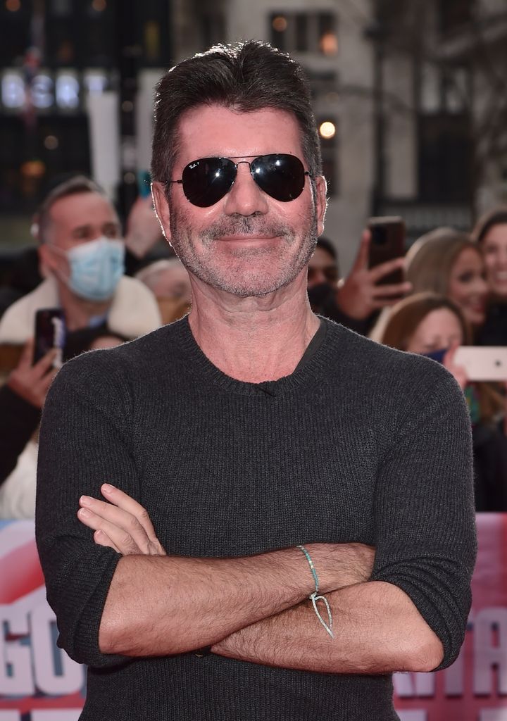 Simon Cowell in a grey jumper and sunglasses