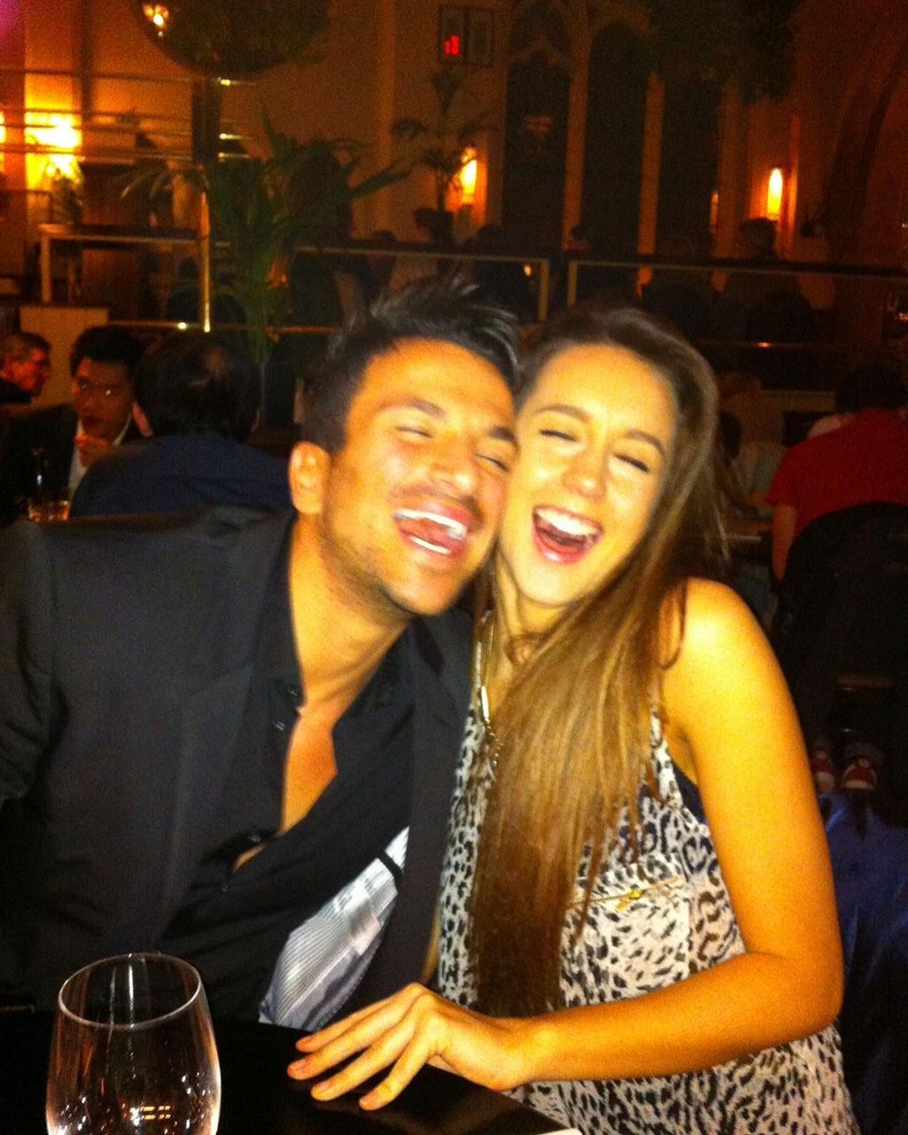 Emily and Peter Andre smiling in a resturant