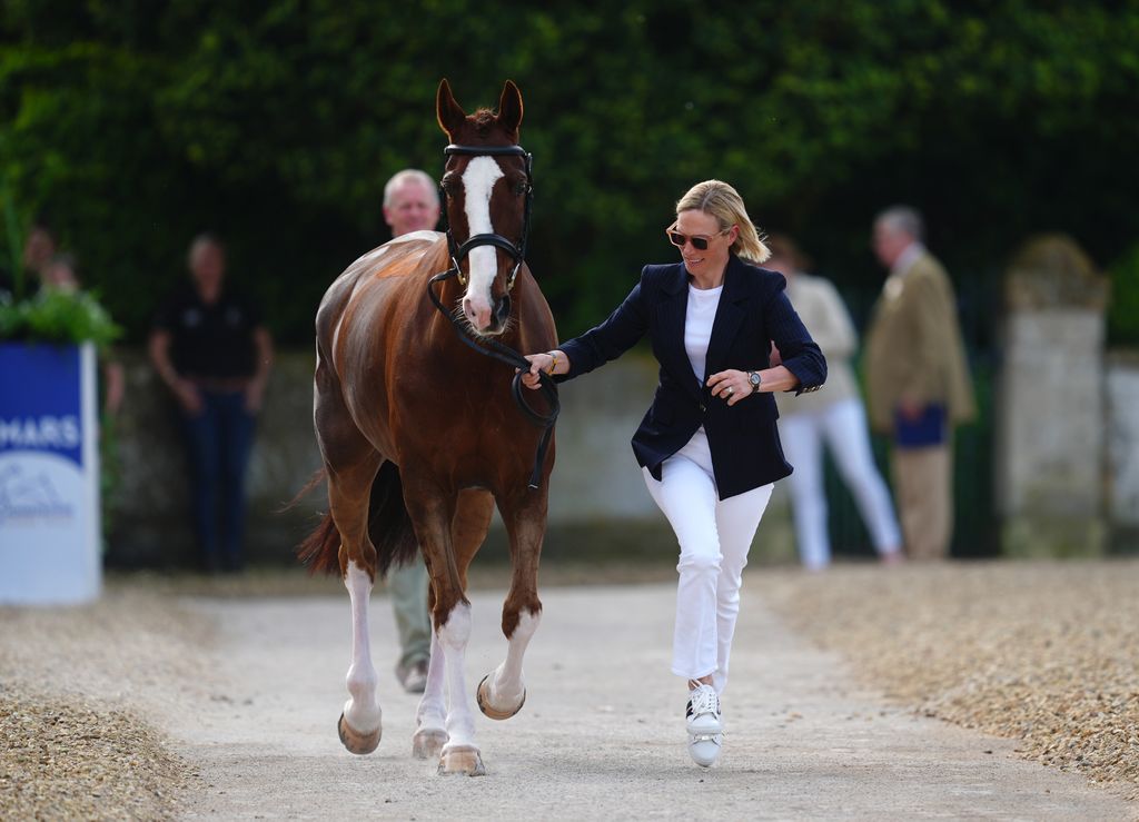  Zara Tindall running beside horse
