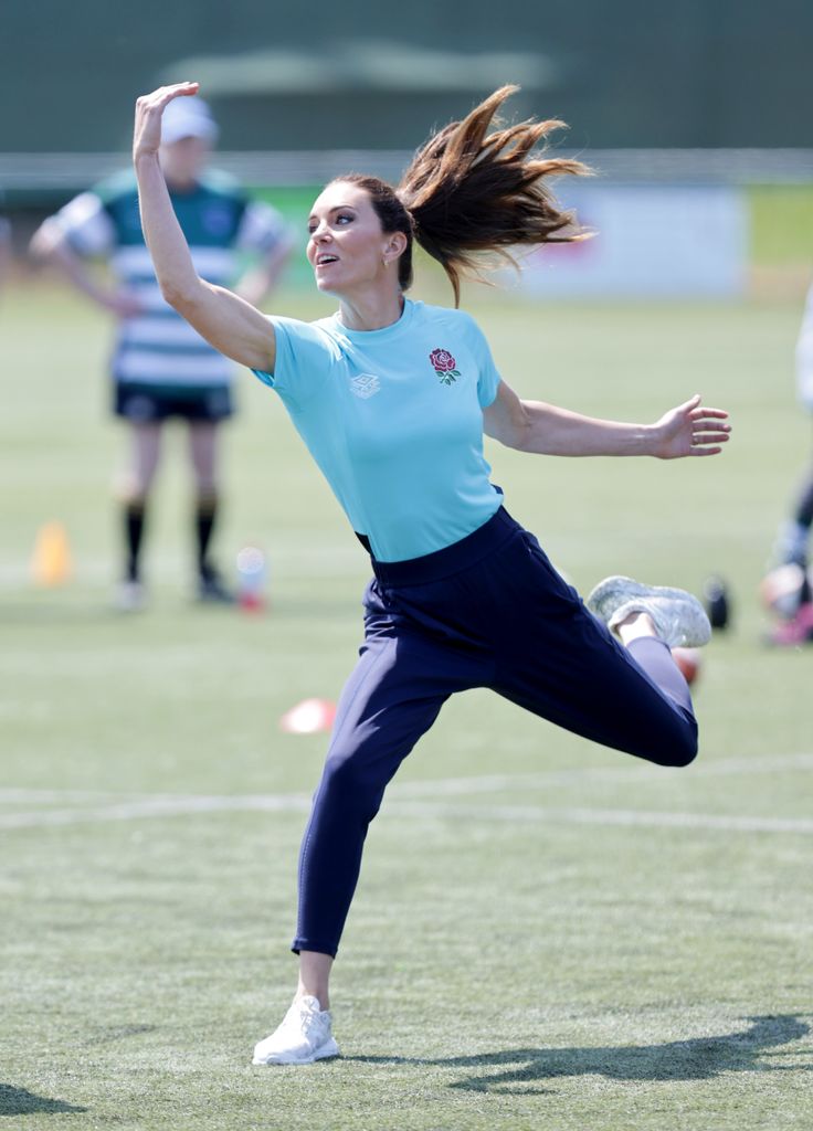 Princess Kate jumping to catch a rugby ball 