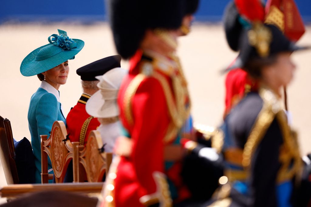 Catherine alongside the King and Queen