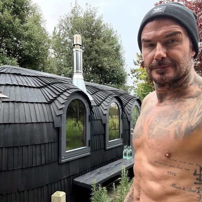 David Beckham standing next to his home sauna