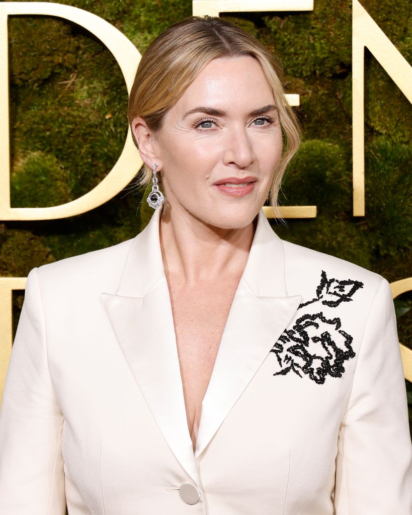 Kate Winslet posed in white suit jacket