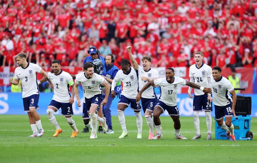 The England team celebrating after winning the penalty shootout 