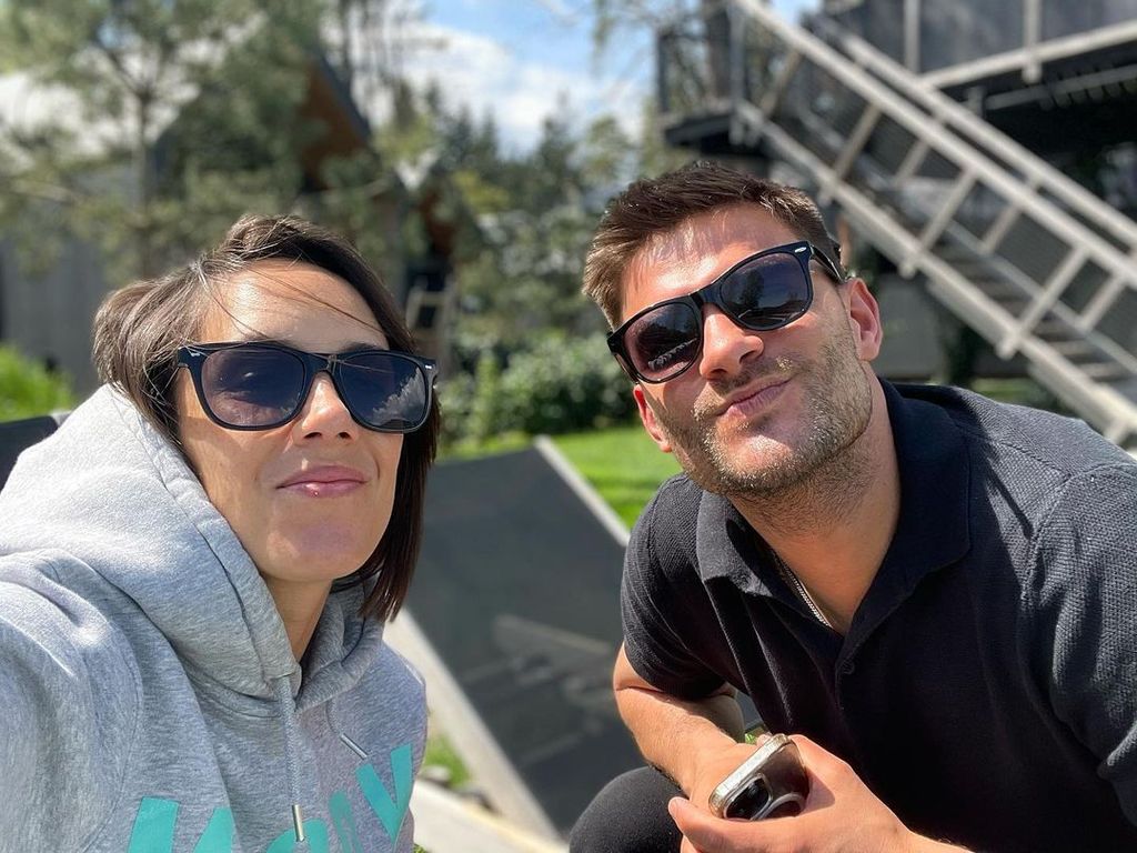 Janette and Aljaz posing for a sun-soaked selfie in Slovenia