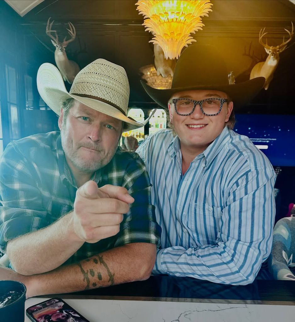 Blake Shelton and his stepson Zuma pose for a photo at a bar wearing cowboy hats, shared on Instagram