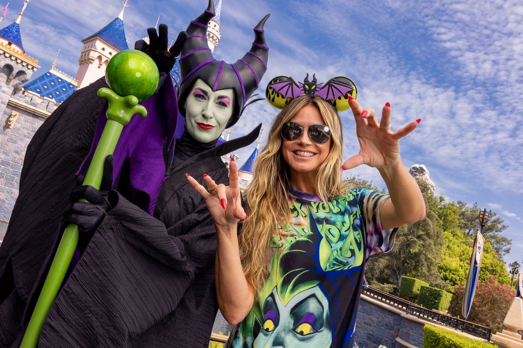 Heidi poses alongside Maleficent at Disneyland 