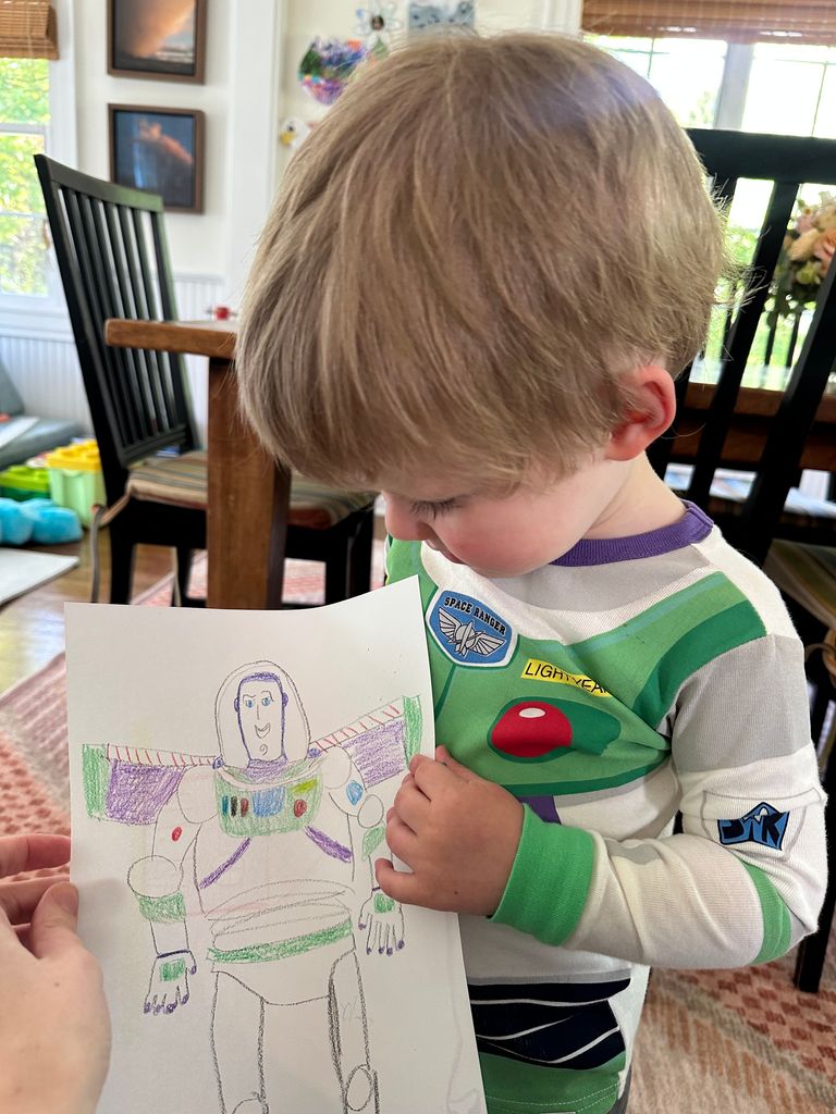 Charlie admiring the Buzz Lightyear drawing I made for him
