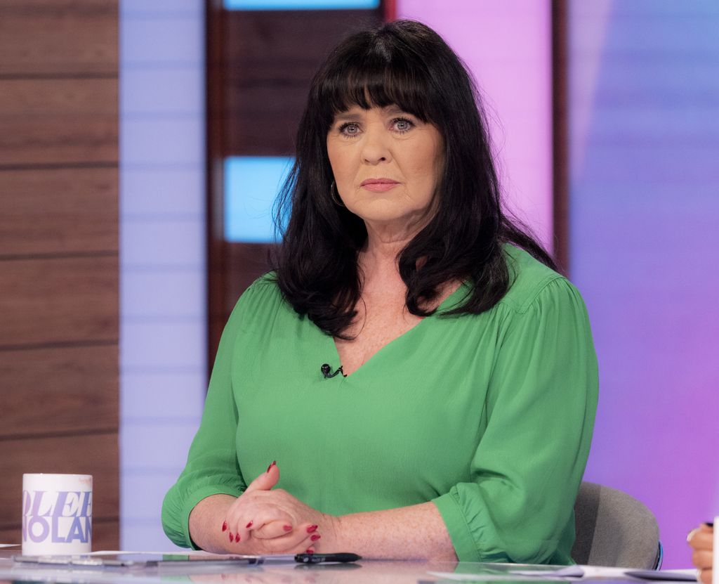 Coleen Nolan looking serious in a green top on Loose Women