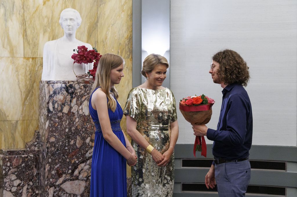 belgian royals receiving bunch of flowers