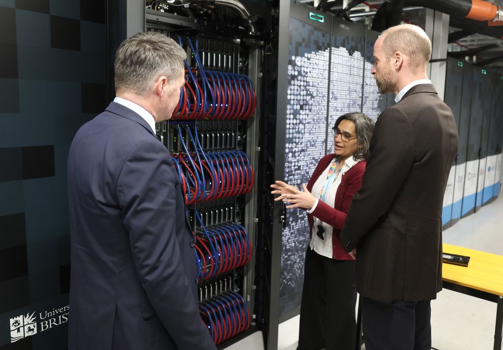 Prince William looking at a supercomputer