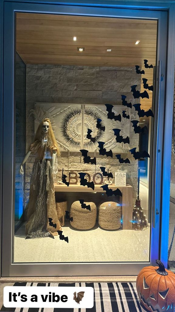 Christina Hall's scary decorations with mannequin, batts and witch's broom